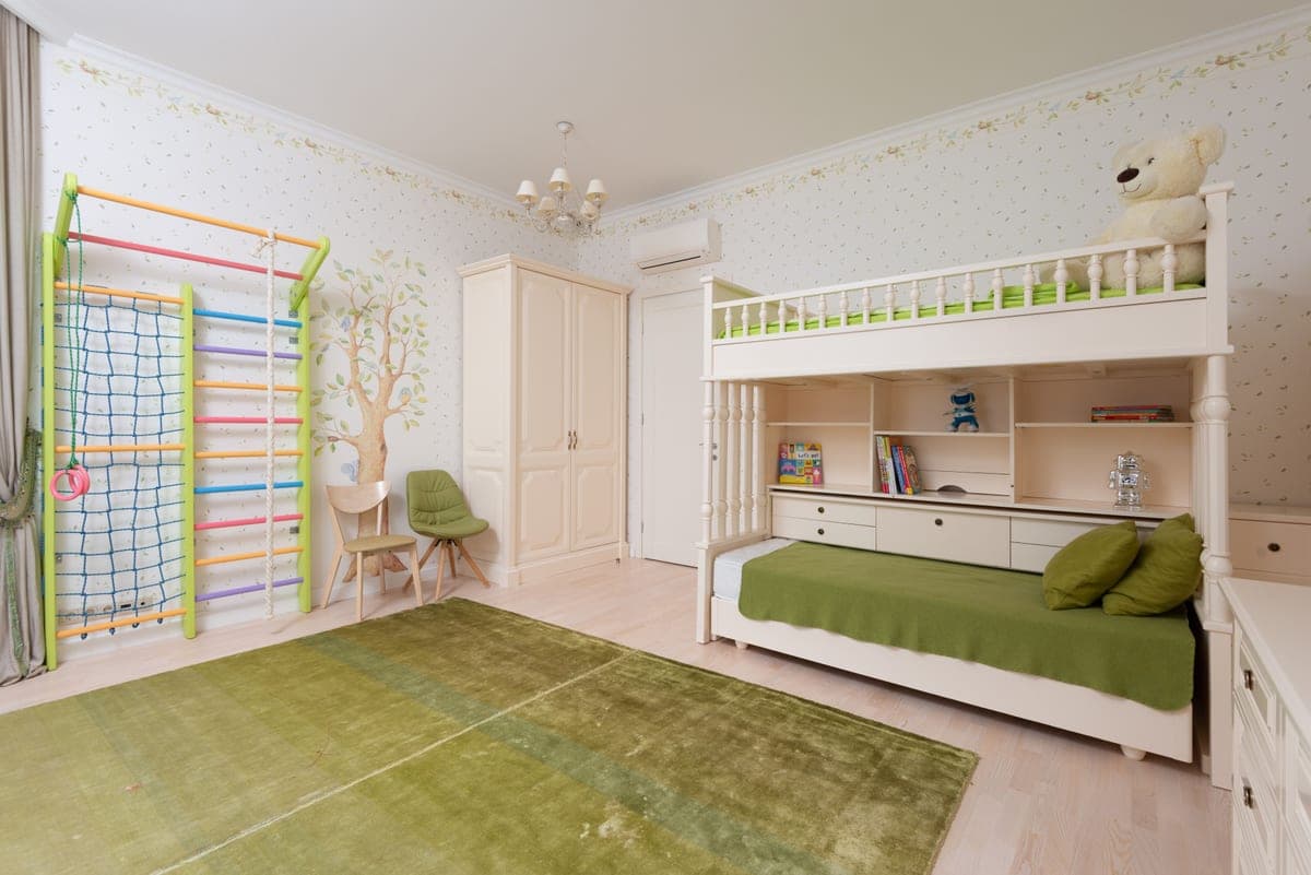 A children's bedroom with a wooden bunk bed