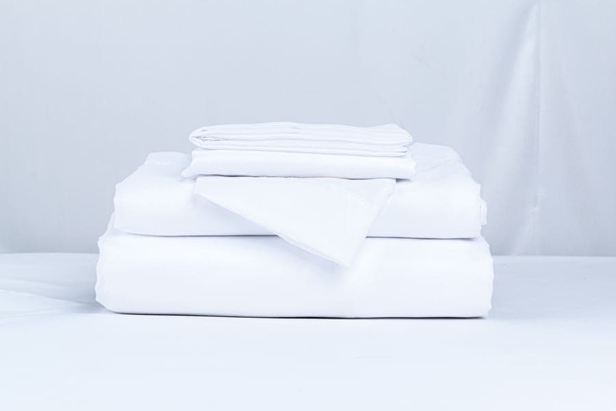 A stack of folded bed sheets