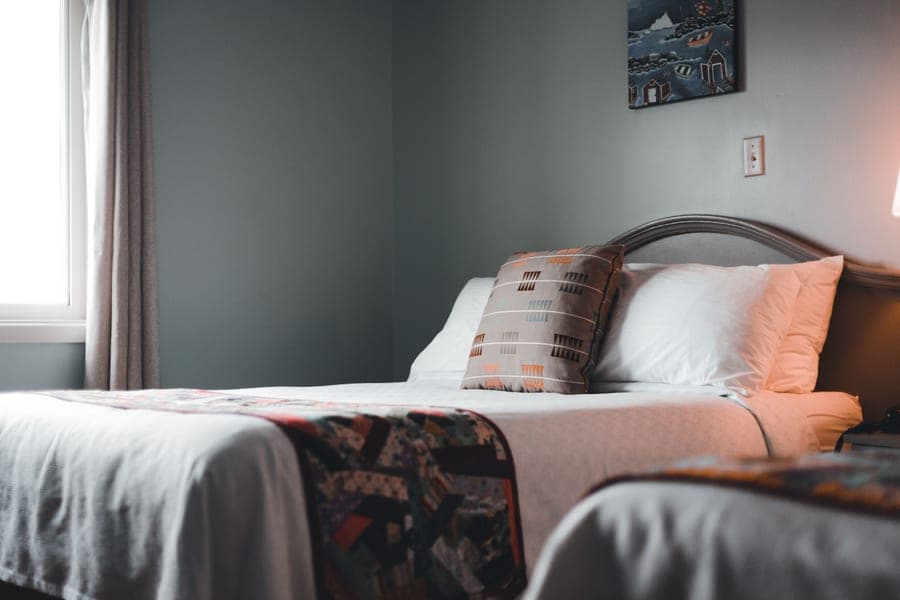 A pillow and duvet on a cozy bed