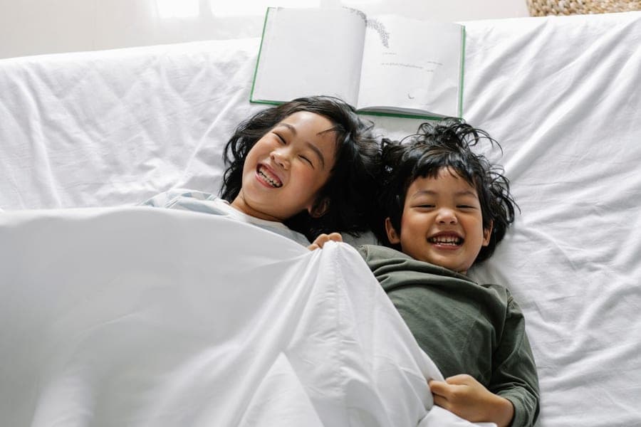 A shared children's bedroom with two beds