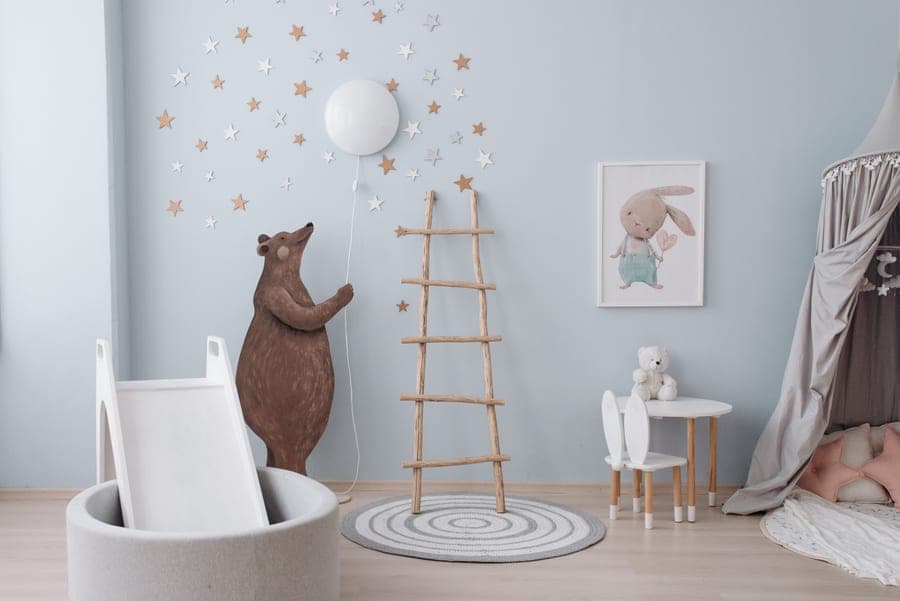 A wooden bed with a ladder in a children's room