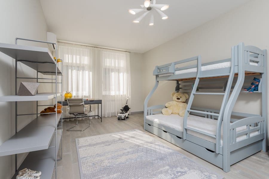 A bunk bed with storage drawers underneath