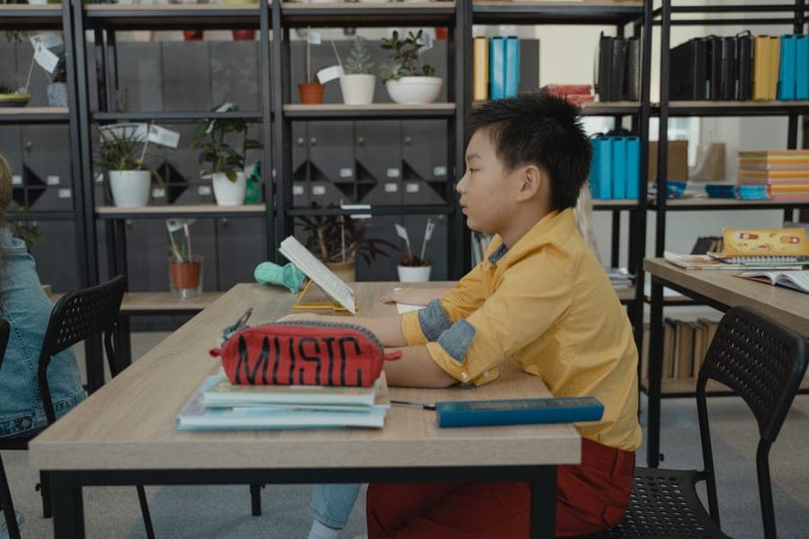A children's desk and chair set up for study