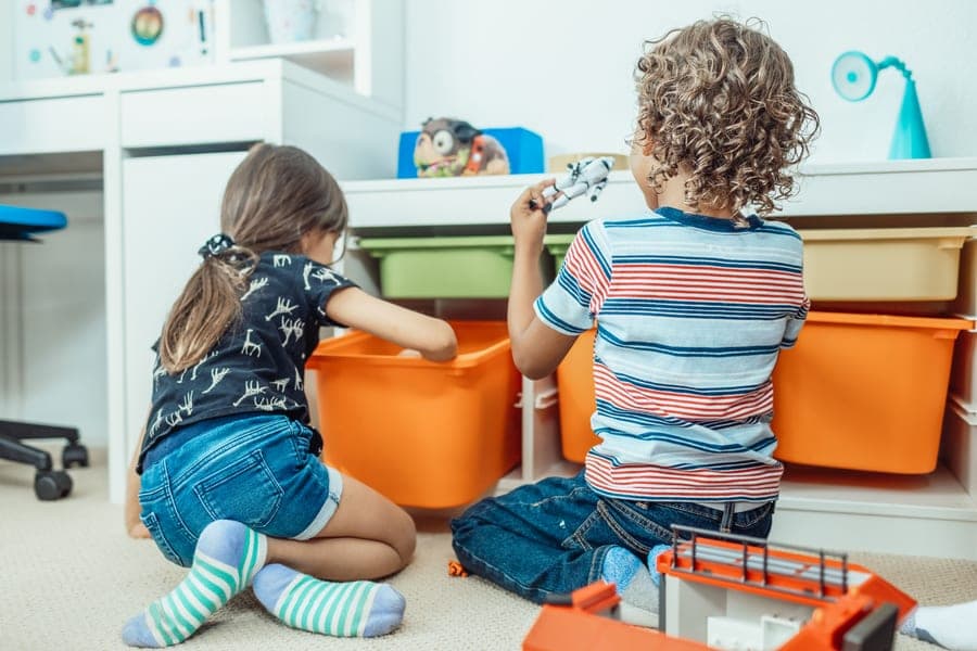 A tall bookshelf beside a child's desk