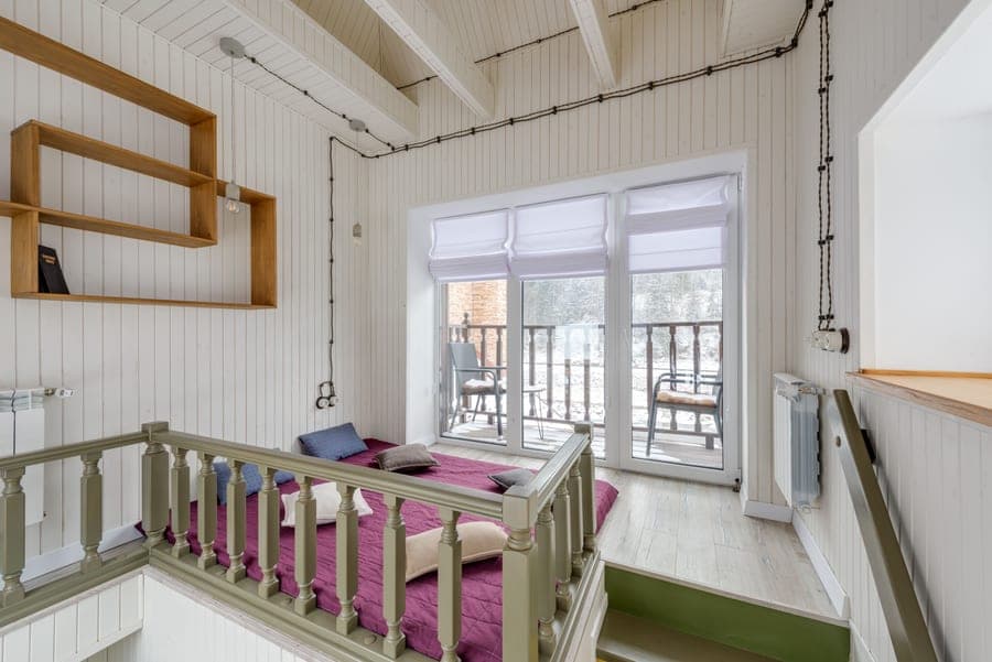 A low loft bed with a play area underneath