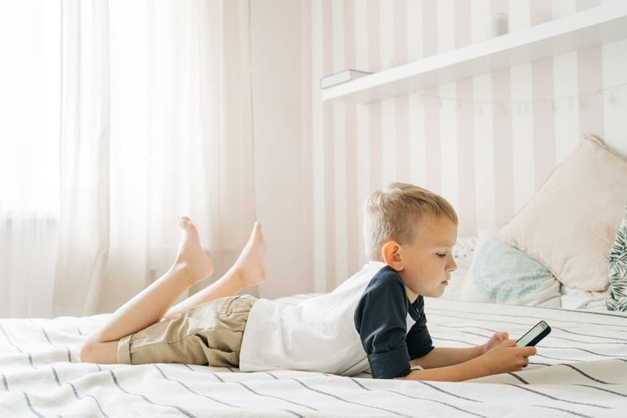 A safety rail fitted along the side of a child's bed