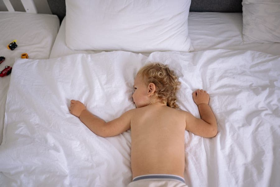 A low wooden toddler bed frame in a child's room